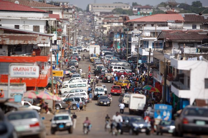 A busy city street in Monrovia, Liberia, in full colour