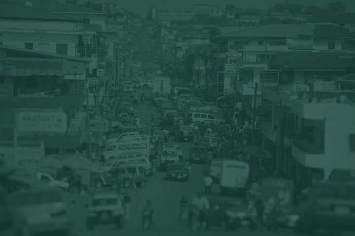 A busy city street in Monrovia, toned Pounamu green